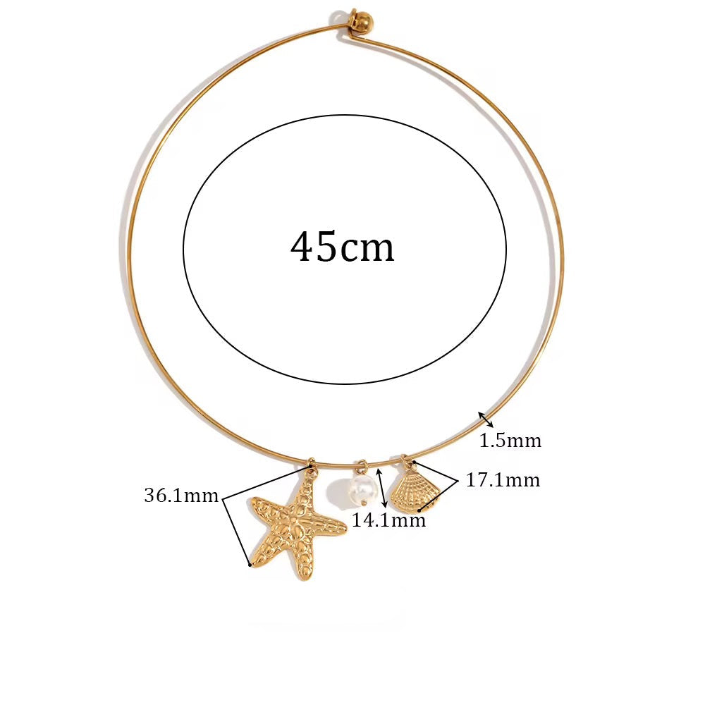 Gold necklace with starfish and shell charms, showing measurements and material details.