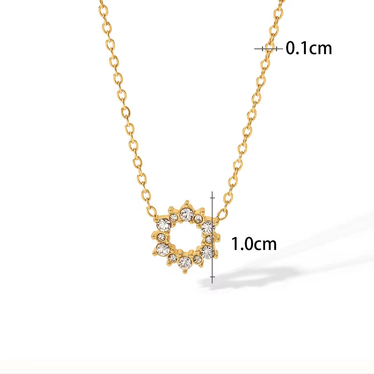 Gold necklace with circular pendant and measurements on a white background
