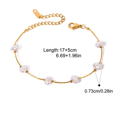 Gold bracelet with pearls on a white background, showing measurements and product details.