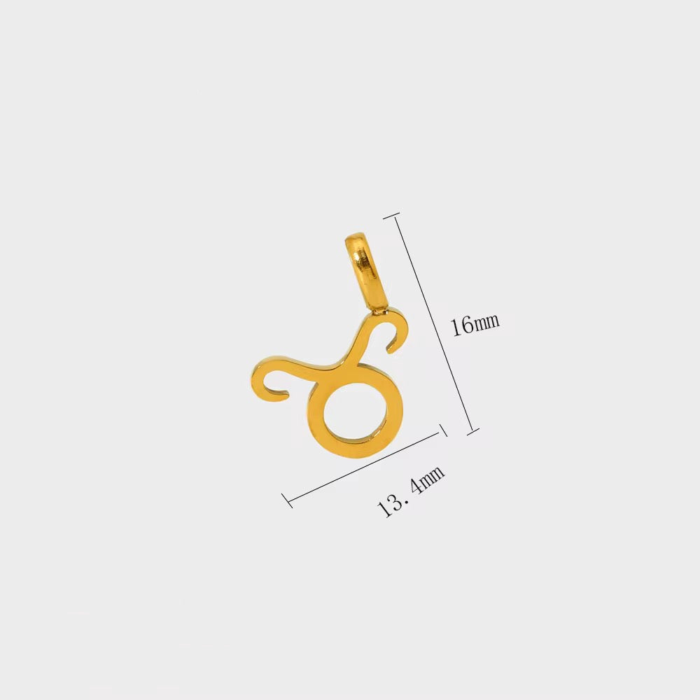 Gold Taurus zodiac pendant with measurements on a light gray background