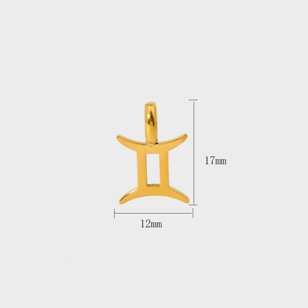 Gold Gemini zodiac pendant with measurements on a white background