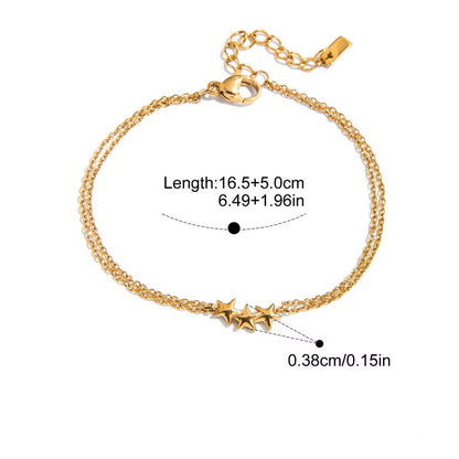 Gold bracelet with star charms on a white background, showing measurements and material details.