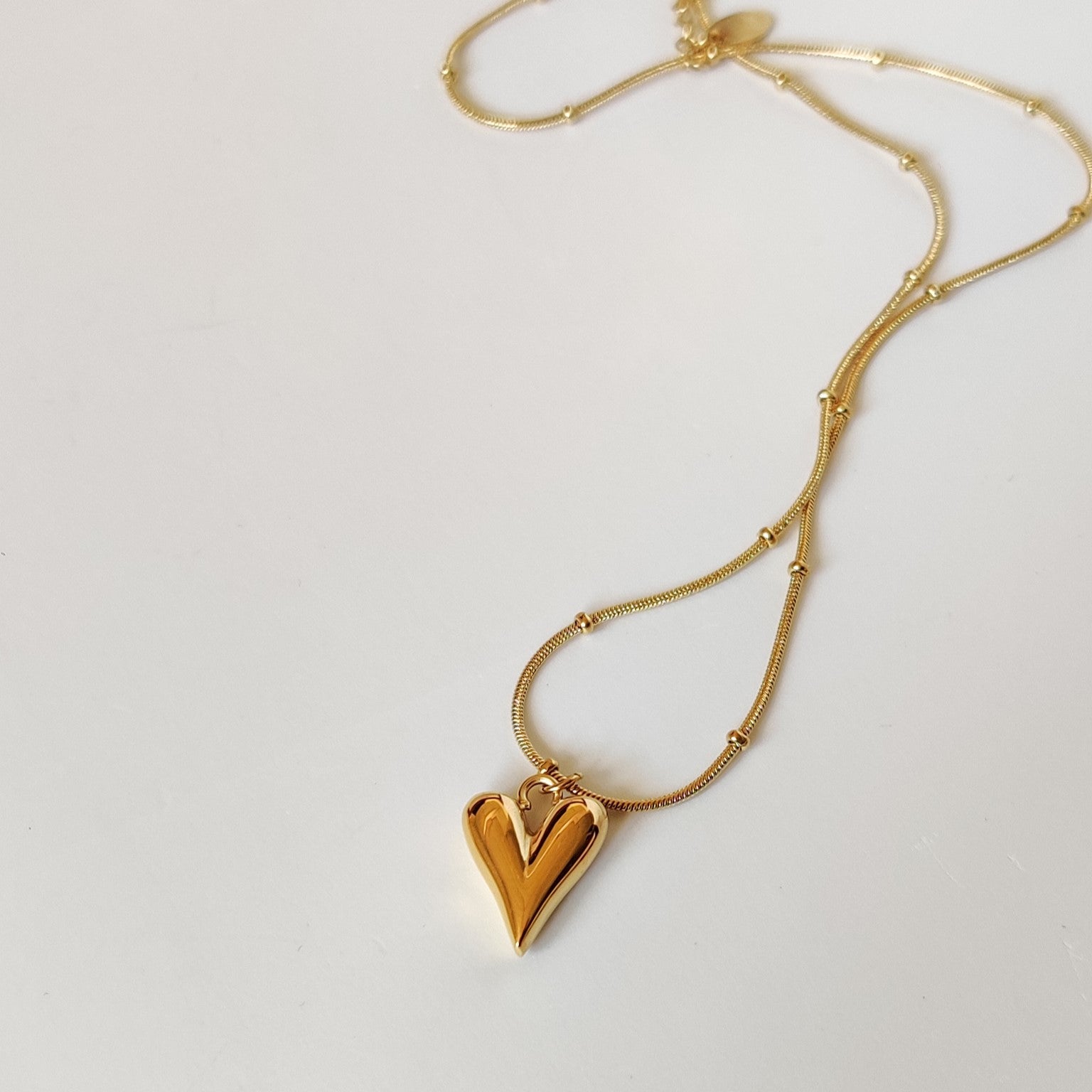 Elongated on sale heart necklace